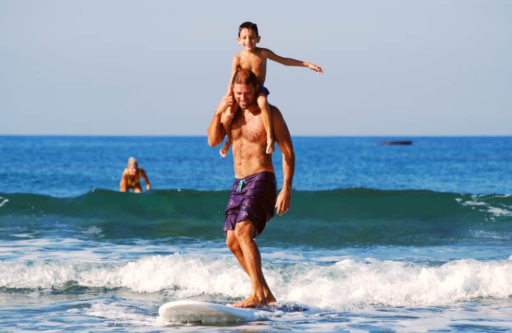 family-surfing-beach