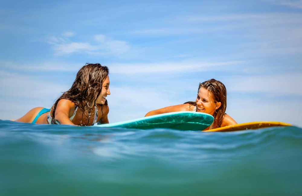 happy women surfing